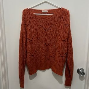 Orange knit sweater by Jolie & Joy